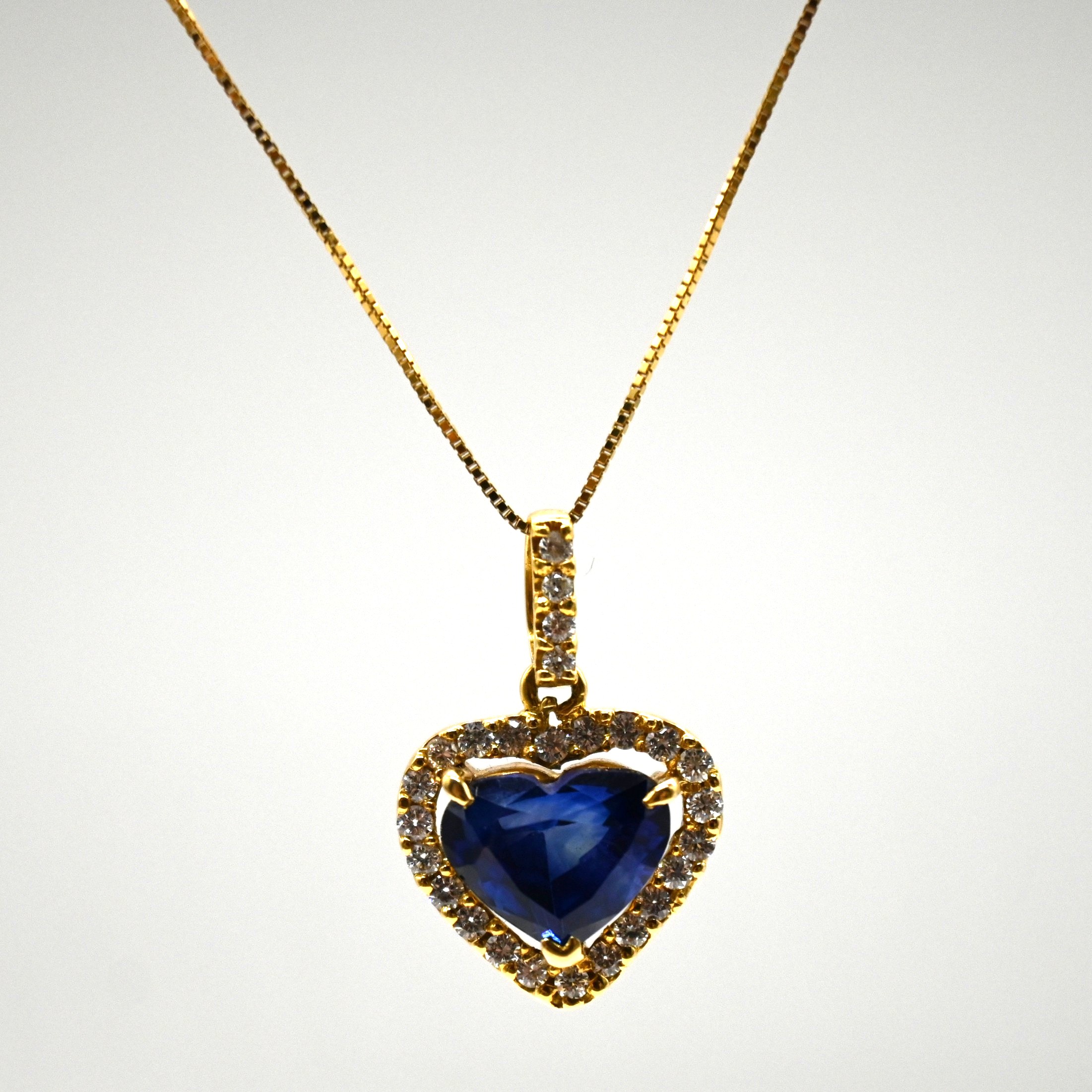 • Metal: 18K Yellow Gold • Center Stone: 3.95ct Heart-Shape Sapphire • Accents: 0.44ct Diamonds • Origin: Sri Lanka, 1.5cm x 1.3cm. 18K Gold Sapphire Necklace, NES001, Heart Sapphire Pendant, Ceylon Necklace