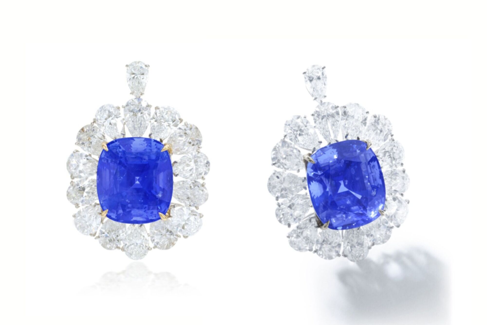 A comprehensive guide to choosing between classic blue and romantic pink sapphire earrings. Sapphire Earrings, sapphire stud earrings, blue sapphire earrings, sapphire pendant, blue sapphire stud earrings, pink sapphire earrings, choosing sapphire earrings.